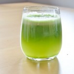 glass of bright green juice